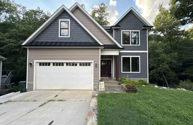 Incredible 5BD, 4.5BA Wake Forest Home Near Falls Lake with a Fully Finished Basement Living Space and a Backyard Haven Including a Large Deck, Fire Pit, and Creek photos photos