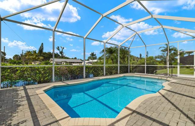 3/3/plus Den, Pool Home on Canal Private Dock and Boatlift . Includes 2nd Master Suite - 9300 Palm Island Circle, North Fort Myers, FL 33903