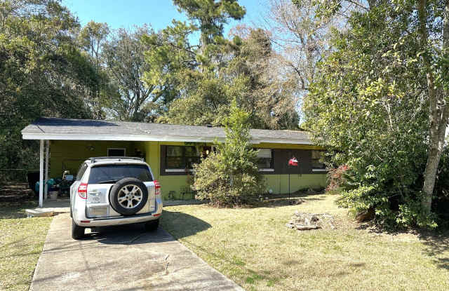 AWESOME 3/2 House Will Have New Paint and Flooring, Fenced Yard w/ Lawn Maintenance Included! Close To the Campus & Collegetown! Available Aug 10th for $1700/month! photos photos