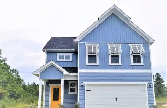 Beautiful home with a charming wrap-around front porch and open floor plan! Gallery 1