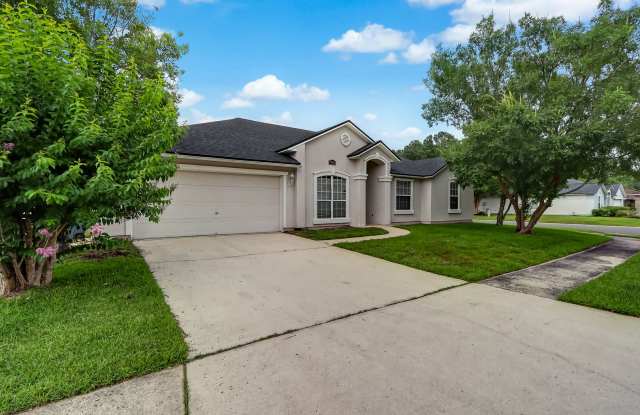 Welcome to this spacious 4-bedroom, 2-bathroom home in Jacksonville! photos photos