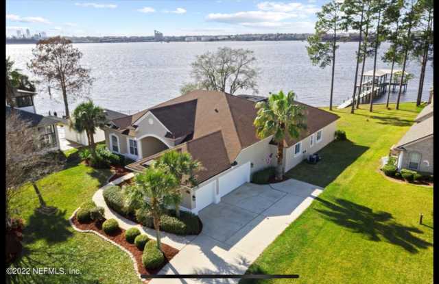 Live Like You're on Vacation Every Day! Stunning Riverfront Home with Unforgettable Sunsets! Gallery 3