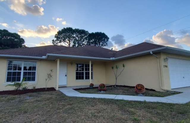 Experience the perfect blend of comfort and style in this charming 3-bedroom, 2-bathroom corner lot home - 790 Southwest Hibiscus Street, Port St. Lucie, FL 34983