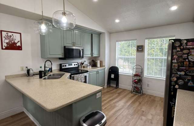 Welcome home to this spacious 4-bedroom, 3-bath residence in Spanish Fork, UT! Gallery 3