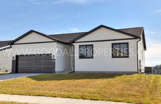 Stunning ranch-style home in Altoona featuring 4 bedrooms and 3 bathrooms, with a finished walk-out basement. photos photos