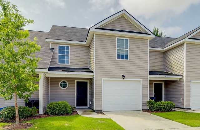 Charming 3BR Townhome with Convenient Main-Level Primary Suite Gallery 1
