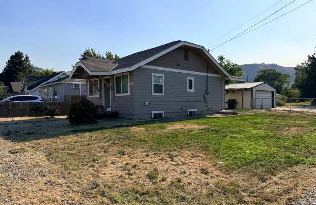Spacious 2 bed/1 bath home! Fenced yard, a/c, d/w, w/d, large garage and MORE!! photos photos