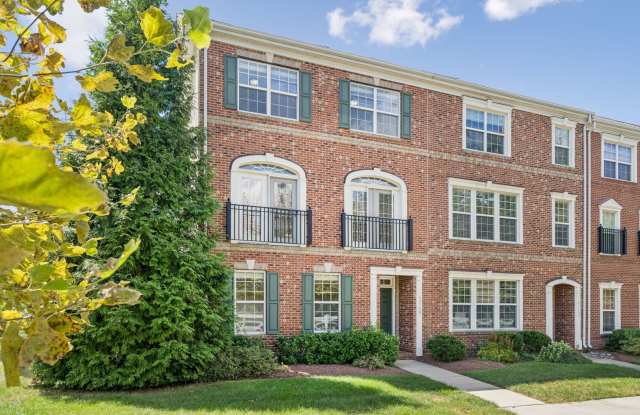 This beautifully maintained end-unit brick-front townhome offers scenic views and stylish finishes throughout. photos photos