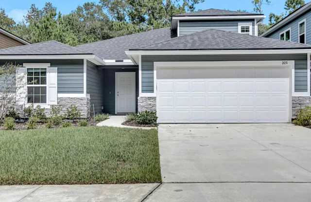 Modern 4 Bed 3 Bath Home in Wilford Preserve! Pet Friendly, Amenities, 2 Car Garage  Covered Walk out Patio! - 2651 Firethorn Avenue, Oakleaf Plantation, FL 32073