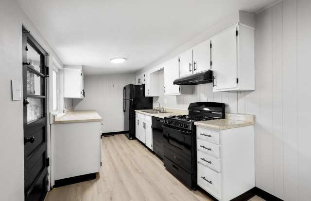 Stunning 3 Bedroom Dravosburg! Freshly Renovated FEATURING UPDATED KITCHEN, BATHROOM with Modern Touches, Central A/C, GARAGE and PARKING PAD! THIS HOME PROUDLY ACCEPTS SECTION 8!! - 117 Skyline Drive, Dravosburg, PA 15034