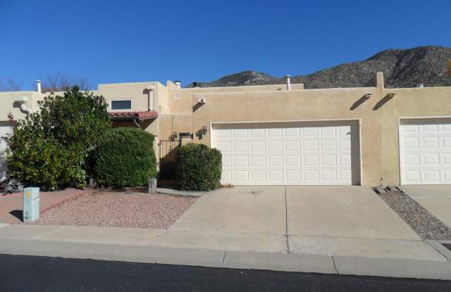 Recently updated 2 Bedroom 2 Bath Townhouse located in the popular foot hills area! - 12800 Comanche Road Northeast, Albuquerque, NM 87111