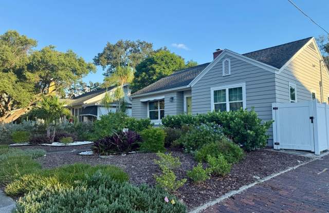 CHARM, CHARACTER & LOCATION — TWO FIREPLACES, BEAUTIFUL HARDWOOD FLOORS & EXPANSIVE OUTDOOR LIVING NEAR CRESCENT LAKE! Gallery 4