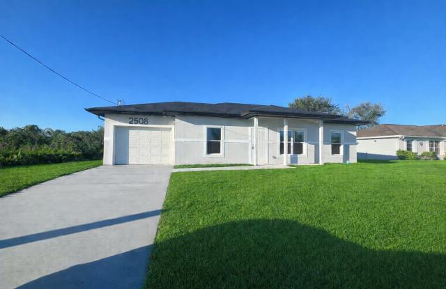 STUNNING NEW 3BR/2BA HOME WITH GARAGE -IN PRIME SW LEHIGH ACRES LOCATION - 2508 29th Street Southwest, Lehigh Acres, FL 33976