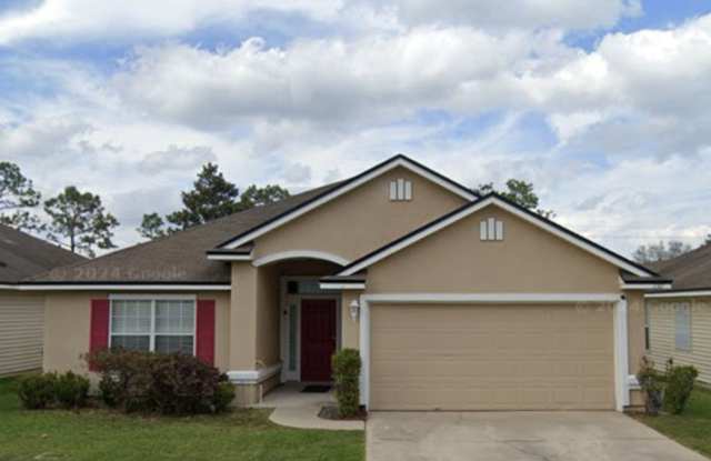 4 Bedroom 2 Bath Brick and Stucco in desirable Silver Creek - 2387 Creekfront Drive, Asbury Lake, FL 32043