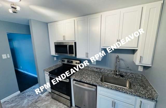"Charming 4-Bedroom Haven with Sunroom, Hardwood Floors, and Modern Amenities!" photos photos