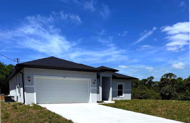 New 4 Bed / 2 Bath / 2 Car Garage Family Retreat in Desirable Lehigh Acres! Gallery 3