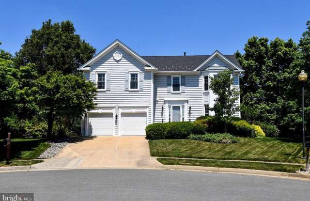 This stunning 4-bedroom, 3.5-bath home is tucked away in a quiet cul-de-sac and filled with exceptional upgrades throughout. photos photos