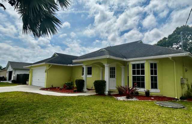 Western Port St. Lucie 3/2/2 with flex/room/den/living photos photos