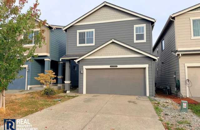Newer Puyallup Home with Attached Garage & In-Home Laundry! Gallery 1