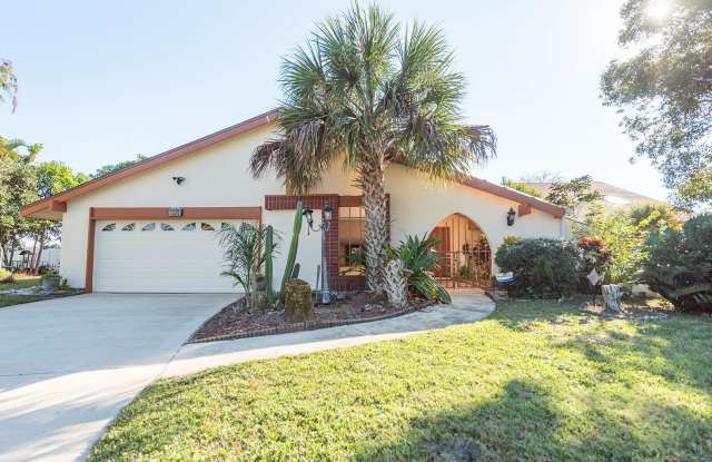 Welcome to this spacious three-bedroom, three-bath home in the heart of Palm Bay photos photos