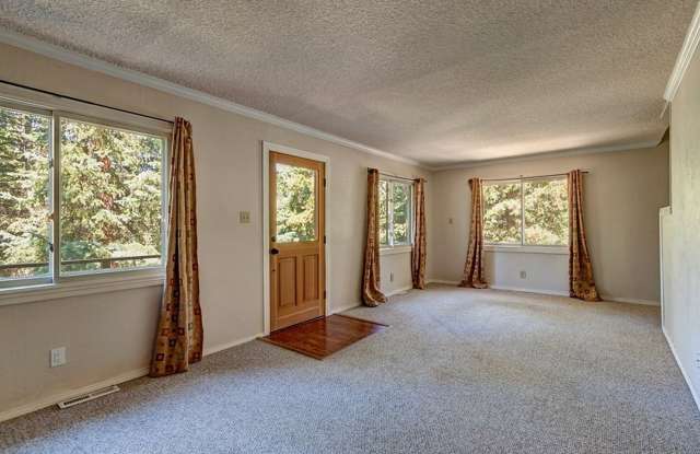 Larger House, Smaller Price. Year Lease. Garage! Extra Fridge! 4th bedroom or extra living! Cabin in the woods! Blue River! New Floors! Gallery 1