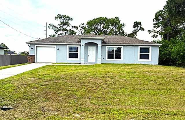 Spacious 3 Bed / 2 Bath Home with Large Backyard in Lehigh Acres photos photos