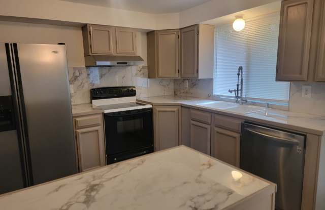 Spacious Spanaway rambler with covered patio and fenced yard. photos photos