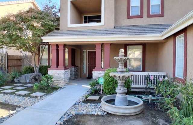 Radiant 4-bedroom, 3-bath home in Fresno, CA! Gallery 4