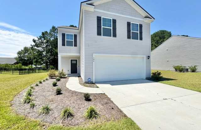 **$1000 off first months rent with acceptable credit and application** Introducing this beautiful like new 4 bed 2.5 bath home located in the Windsong II S/D - 405 Sea Breeze Drive, Rincon, GA 31326