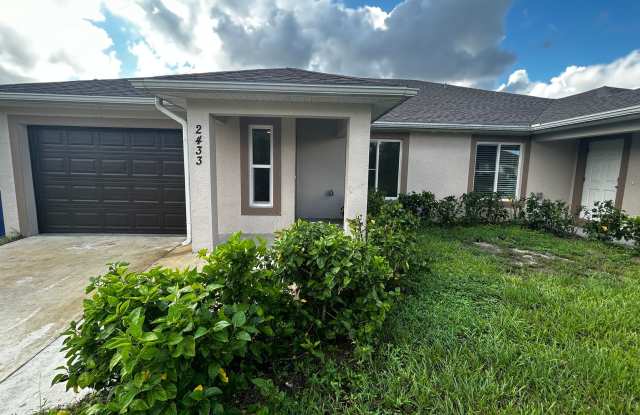Newer 3 Bed 2 Bath 1 Car Garage Duplex Available Now - Lehigh - 2433 Quentin Avenue South, Lehigh Acres, FL 33973