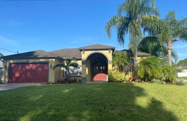 Well maintained large 4/2/2 corner lot pool home on a canal photos photos