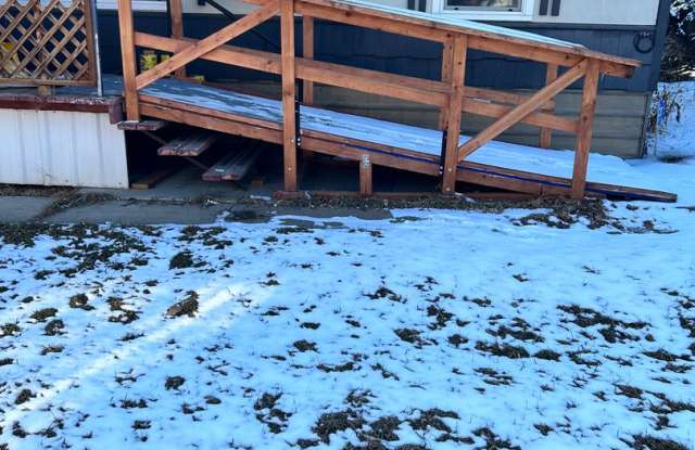 Three-Bedroom Double Wide with Fenced Yard - 1908 Montana Avenue Northeast, Black Eagle, MT 59414