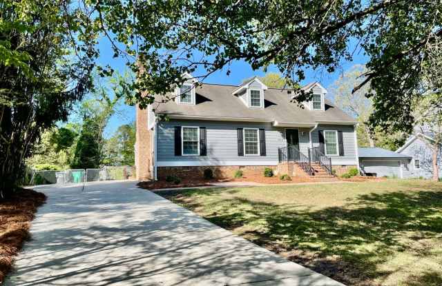 Welcome to view, a charming 4-bedroom, 2-bathroom home located in the heart of Charlotte, NC. - 6215 Deep Forest Lane, Charlotte, NC 28214