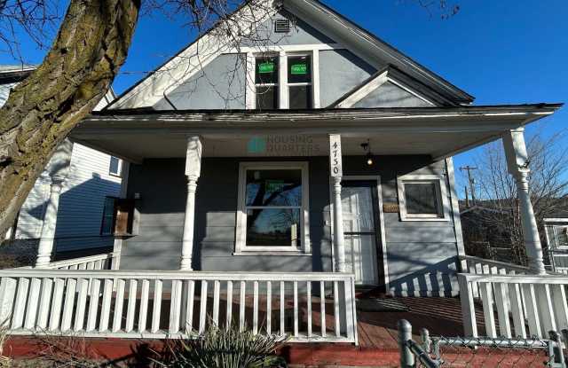 This 3-bed, 1-bath home features original woodwork, a covered front porch, a fenced yard, and an oversized detached garage! photos photos