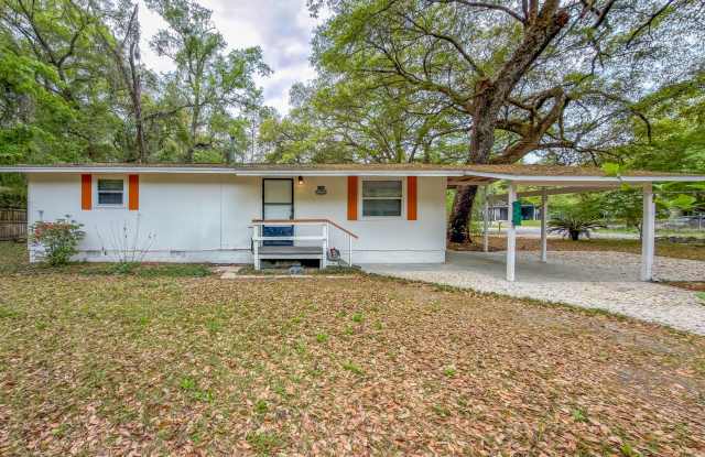 UPDATED 2/1 House w/ Stainless/Black Appliances, Washer/Dryer, & Carport! Walkable Location! Available NOW for $1275/month! photos photos