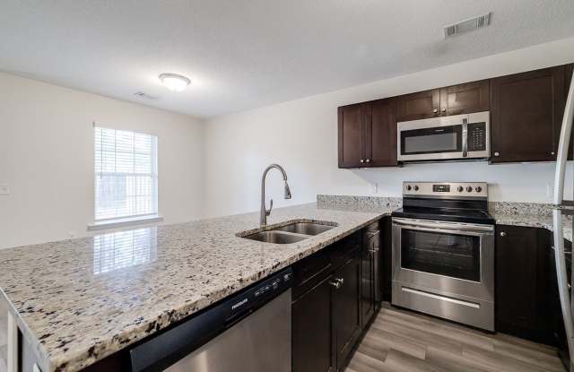 Charming 3BR Townhome with Convenient Main-Level Primary Suite Gallery 3