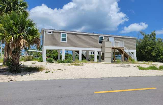 Centrally-Located 2-Bed/2-Bath Home with Canal Access (full perimeter fenced installed by 7.4.25) photos photos