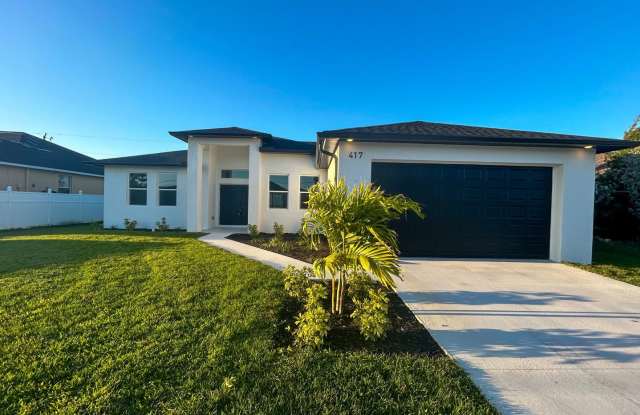 Stunning New Construction Home in Desirable Cape Coral Neighborhood - Modern Design, Spacious Layout, and High-End Features Throughout photos photos