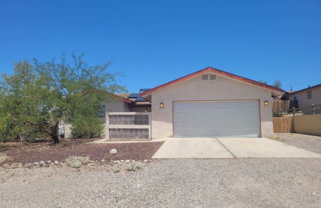 Cozy 3-Bed Home in Central Bullhead City with Fireplace  No HOA photos photos