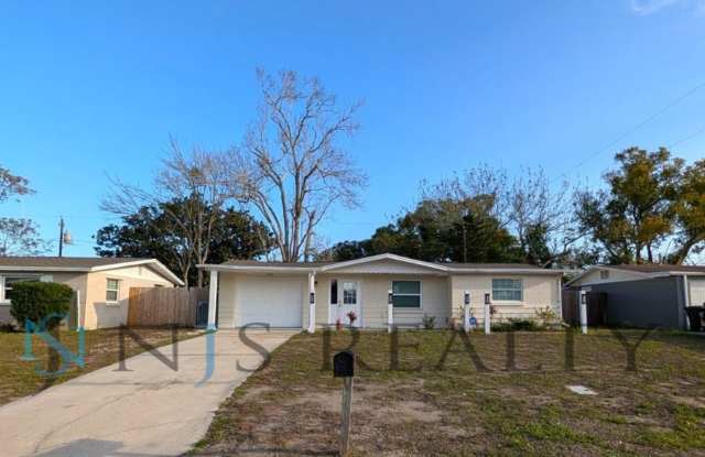 Fabulous 3/1/1 980 Sq. Ft. with NEW AC, NEW flooring, UPDATED kitchen  bath with GRANITE counters and HUGE backyard!!! photos photos