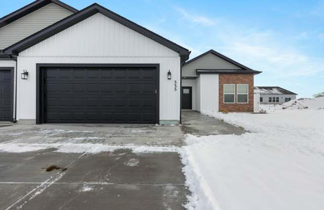 DARLING twin home located in Sugar City, Idaho 3 Bed 2 full baths with fully fenced yard and XL 2 stall garage Gallery 1