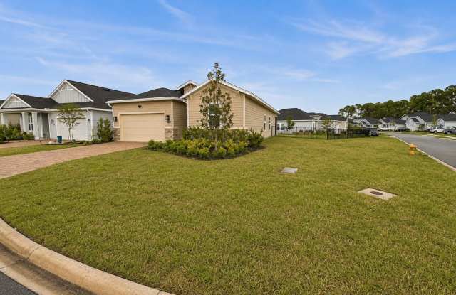 Spacious 4BR/3BA on Large Corner Lot! Water Views, Screened Patio, Double Garage & Outdoor Fireplace! Gallery 3
