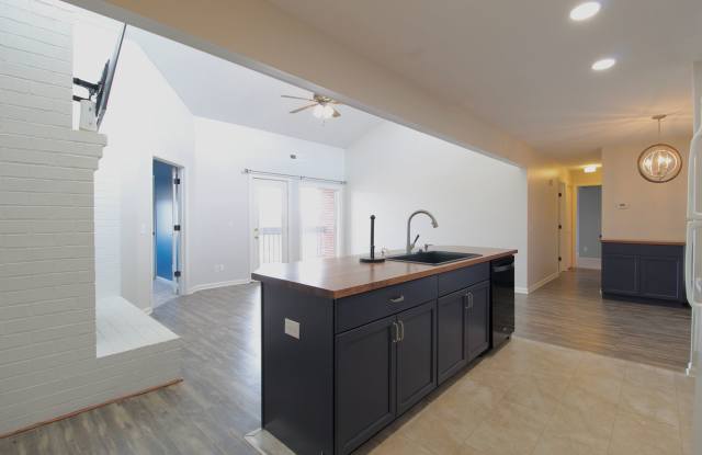 Top floor completely remodeled condo with open concept, vaulted ceilings and an electric fireplace! photos photos