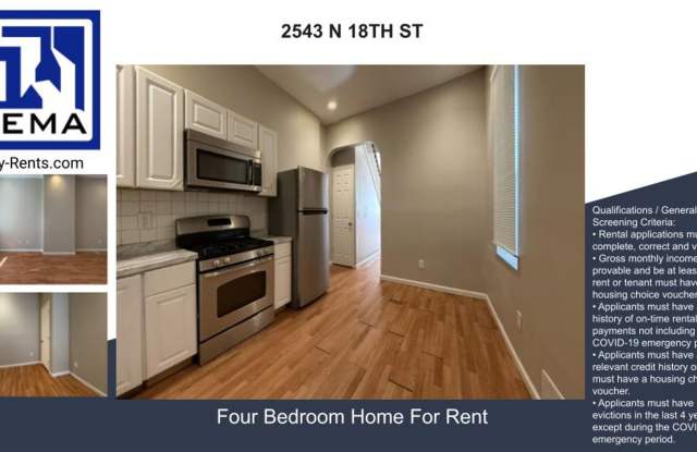 Charming 4BR/2BA Rowhouse with Hardwood-Style Flooring Throughout Gallery 1