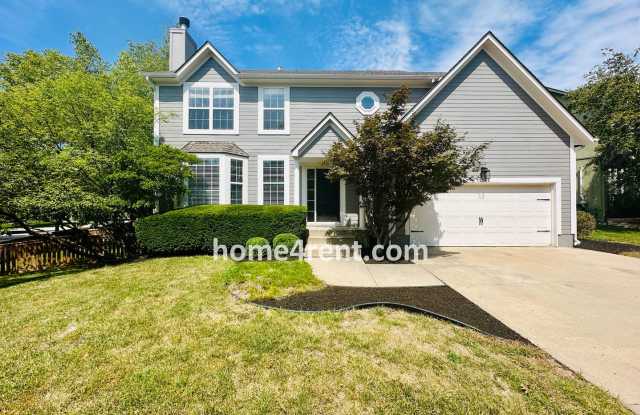 A Fantastic Four Bedroom, Olathe Home w/ New Paint and Carpet, Refinished Hardwoods, Finished Basement and a Fenced Yard! photos photos