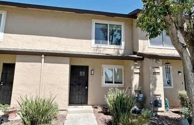 Move-in ready Evergreen townhome with private backyard, detached 2-car garage, and great community amenities photos photos