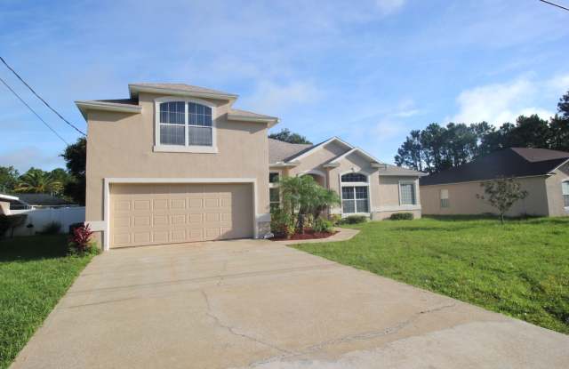 Spacious 4 Bed 3 Bath 2500SQFT Home with FENCED YARD AND SCREENED LANAI Rent! - 25 Bird of Paradise Drive, Palm Coast, FL 32137