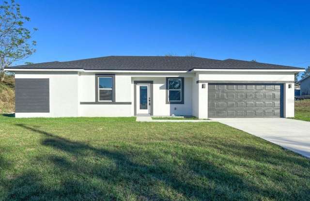 This immaculate, newly built 4-bed, 2-bath home in Port Charlotte is move-in ready or perfect for renting out! photos photos