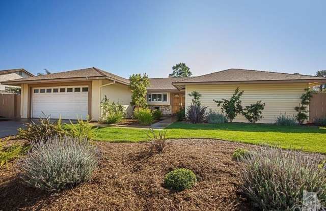 Located on a tree-lined street is this meticulously renovated single-story home. photos photos