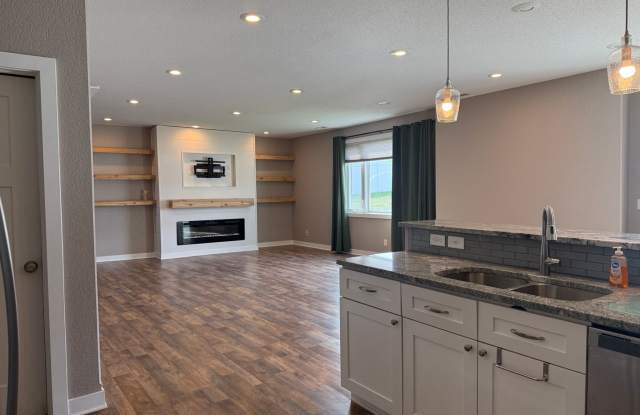 Spacious 4-Bedroom Twin Home | 3-Stall Garage + Fenced Yard photos photos
